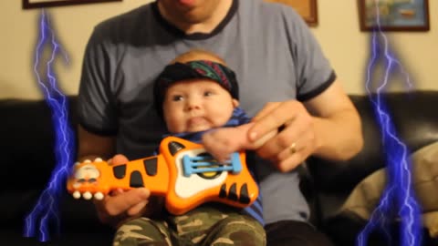 Cutest metal band video ever! Baby plays air guitar like a boss!