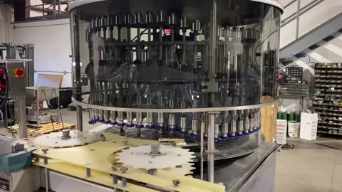 U.S. Bottlers 60-valve Pressure Gravity Rotary Bottle Filler