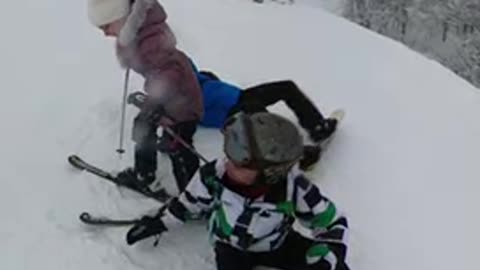 Heroic snowboarder leaps into action to save falling little girl