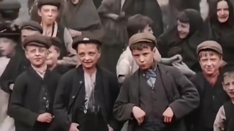 Kids on the streets of England, 123 years ago in the year 1901.