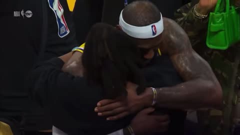 Lebron hugs JayZ who wears shirt that says “this is black magic”