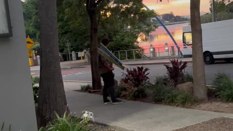 Man Carries Around Street Sign