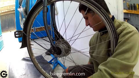 Removing dynamo and roller brake hub front wheel