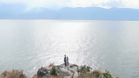 Couples watching the sea on the mountain