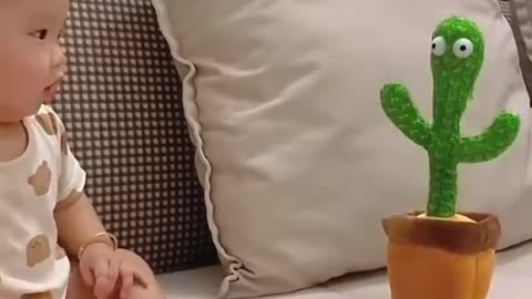 cute baby and dancing cactus.