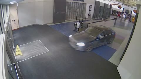 DRIVE IN: Car Thieves Smash Into Shopping Centre At Night And Cruise Around Robbing Goods