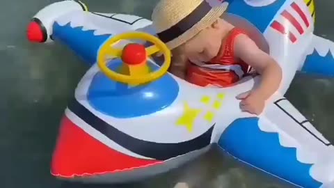 Cute baby sleeping while he playing in the sea