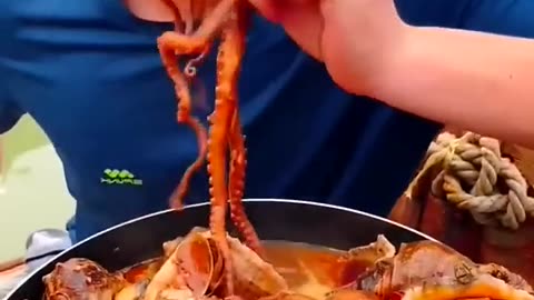 Chinese Man Eating Seafood