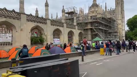 Students at Cambridge University chant in Arabic outside their campus.