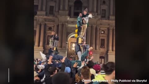 Eagles Fans “Surf” Crowd, Climb GREASED Poles in Celebration Chaos