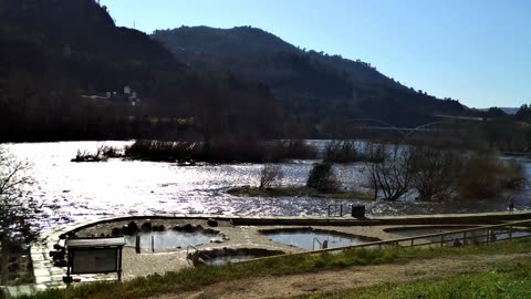 Beautiful Miño River as it passes through the Muiño da Veiga hot springs in Ourense, Galicia