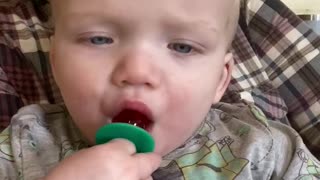 Twin tries a ring pop for the first time. Adorable