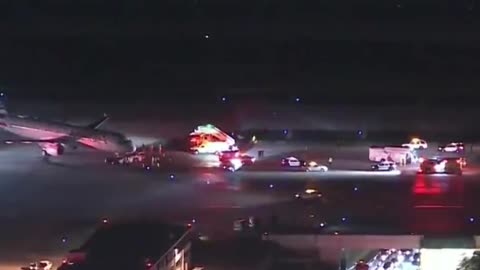 American Airlines Plane Being Towed Clips Passenger Bus on Tarmac