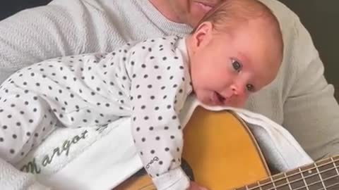 "YOU GOT A FRIEND IN ME" - baby loves Dad signing with guitar