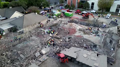 S. Africa building collapse: rescuers search through rubble