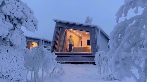 Frozen Wonderland: A Breathtaking View of an Ice-Encased Finnish Cabin"