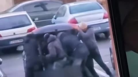 A man kidnapped and forced into the trunk of a car by armed kidnappers, Villeparisis, France.