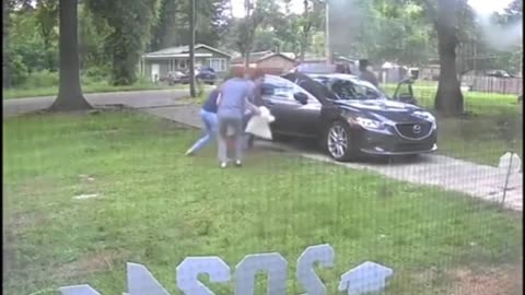 Family carjacked in own driveway with kids in car