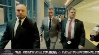 Albert Bourla confronted by Project Veritas. His hired goons push a female reporter out of the way.