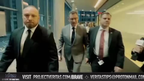 Albert Bourla confronted by Project Veritas. His hired goons push a female reporter out of the way.