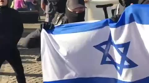 “Antifa waving the flag of their masters“