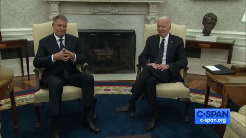 Biden looks as his handlers remove the reporters from the room