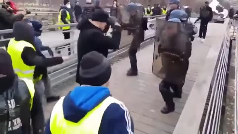 Former pro boxer takes on french riot police during protest. OLD BUT GOLD