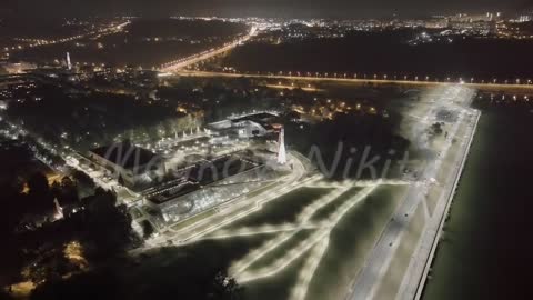 A-Log. Kaluga, Russia. Yachenskaya embankment. Space rocket. Night flight over the city, Aerial View