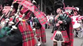The Scots Guards marching to the Scottish Parliament in Edinburgh in 2019. Playing the bagpipes