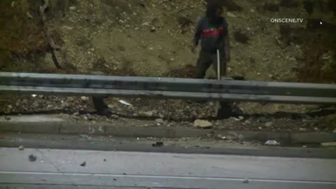 Man throws rocks onto freeway in LA, causing a motorcyclist to crash!