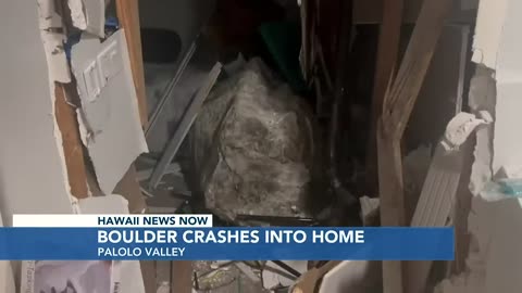 Boulder crashes into a home