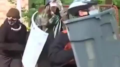 Protesters Rush Cops With Trash Can Shields