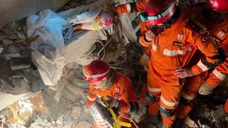 Rescue Workers Digging Through Rubble Overnight Seeking Survivors