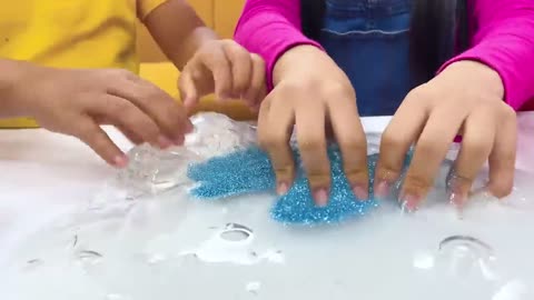 Baby playing with slime