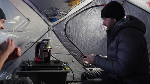 Winter Camping on the Ice in a fishing hut in freezing conditions