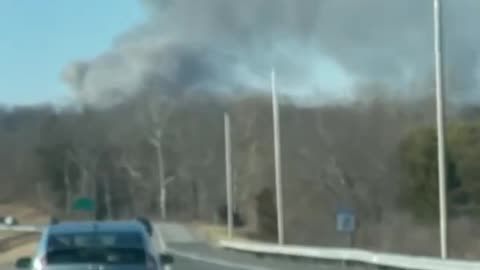 Multiple fire departments are responding to a massive three alarm fire