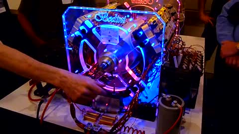 Free Energy 12 coil Bedini motor used in a demonstration to charge batteries with explanations