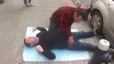 Luodong Massages Man In Black Shirt On Sidewalk