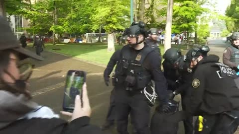 Occupiers flood from Portland State University's library Thursday morning
