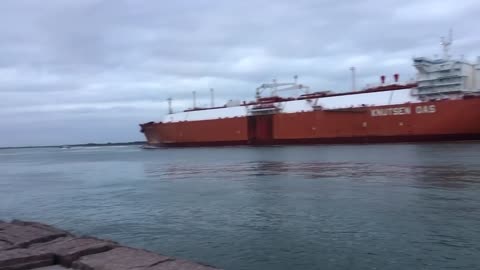 Liquified natural gas tanker assisted by tugs port Aransas