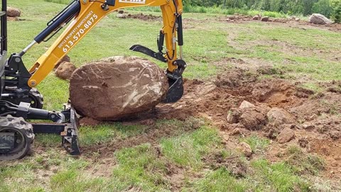 2 Ton Excavator Digs Out 3,000lb Rock