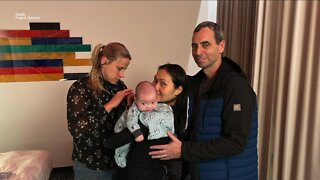 Family united for the first time after baby twins were trapped in Russia
