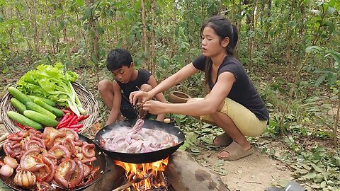 Tasty Cooking Pork intestine and eating delicious with fresh vegetable for jungle food