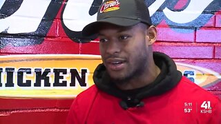 Chiefs WR JuJu Smith-Schuster serves up chicken tenders at Raising Cane's in Olathe