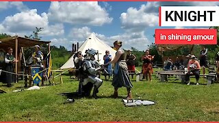 Fantasy-mad 'knight' proposes after challenging his girlfriend to a MEDIEVAL sword fight