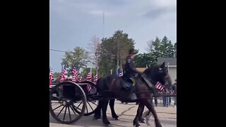 A flagged lined street as fallen Fargo Police Officer Jake Wallin is honored by his fellow cops...