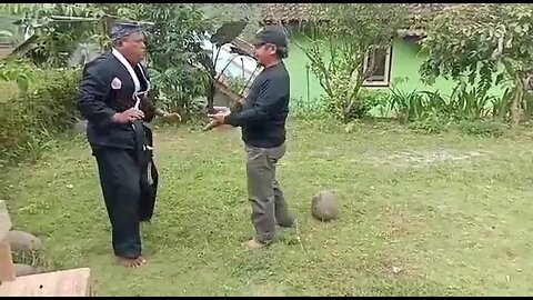 Martial Artist Takes Stone Ball To The Back