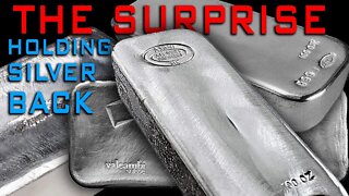 The Surprise Holding Silver Back