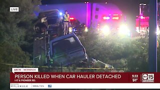 One dead after crash involving car hauler