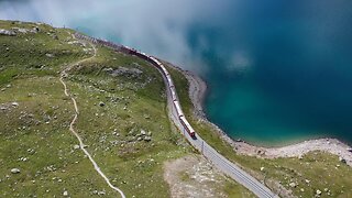 Train driving in the mountains of a beautiful landscape code